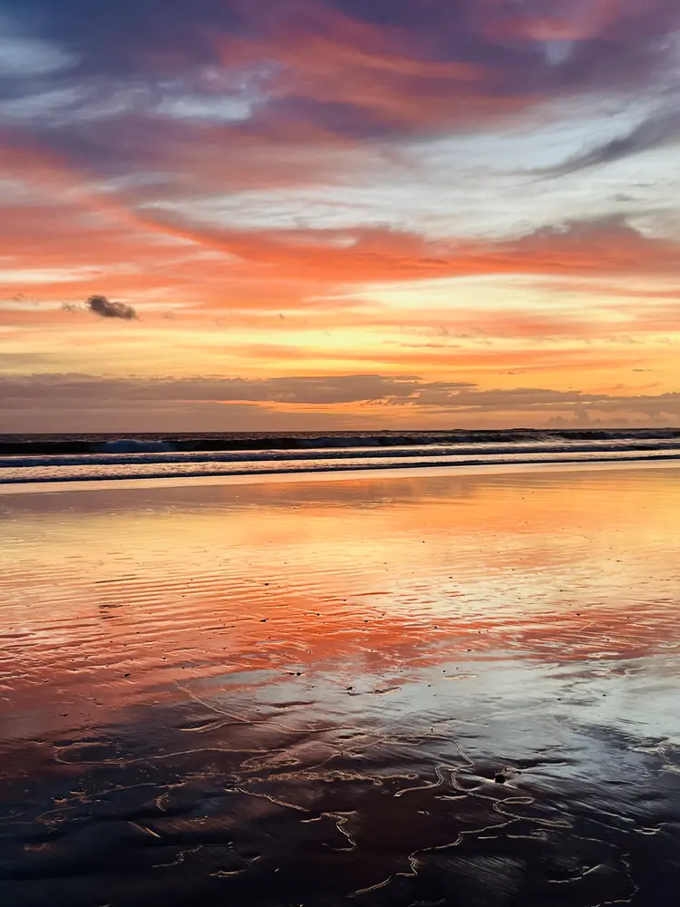 The afterglow doubled on wet sand