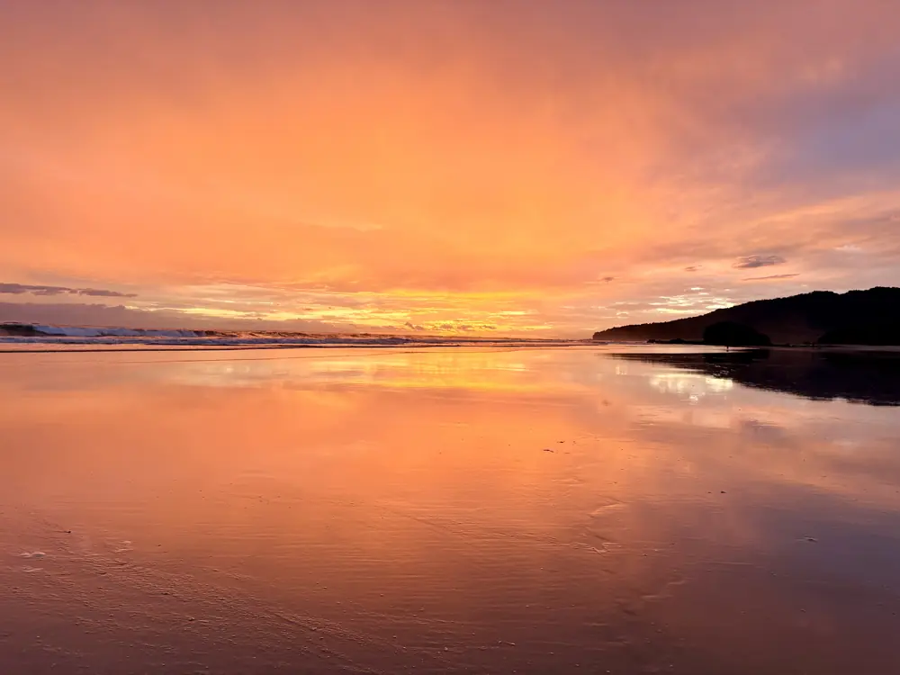 The whole sky on fire, mirrored in the sand