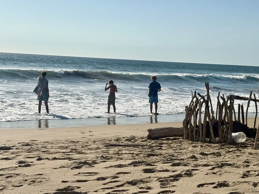 A driftwood fort and wading in the surf