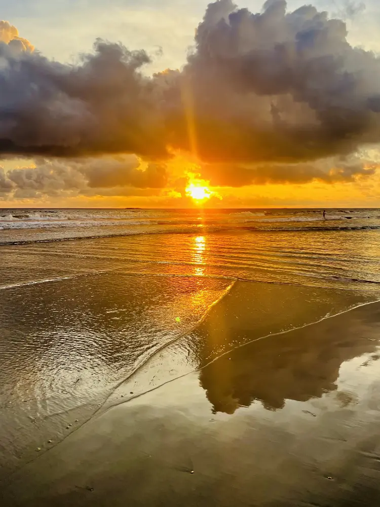 Golden sunburst over the surf