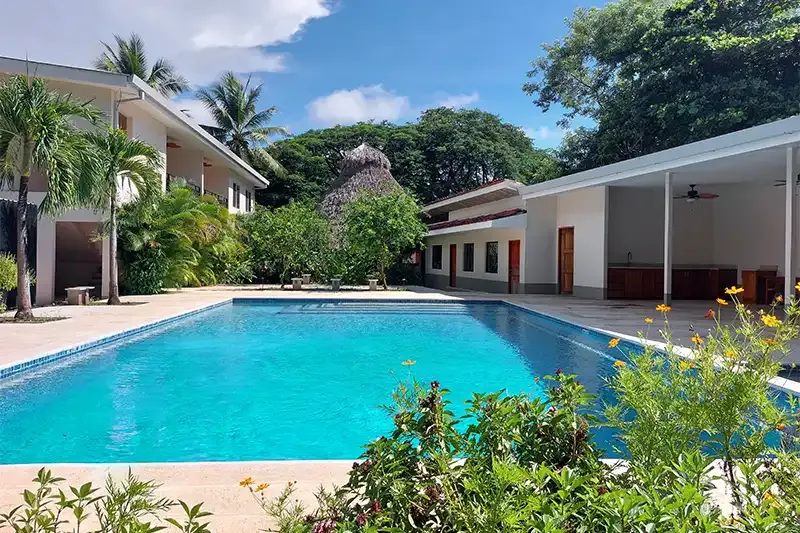 Pool and gardens at Palm Beach Inn, Playa Grande