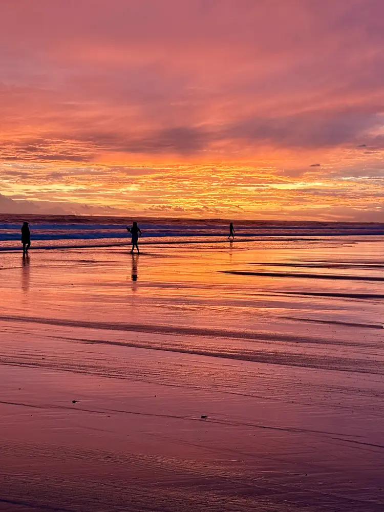 Walkers in a pink afterglow