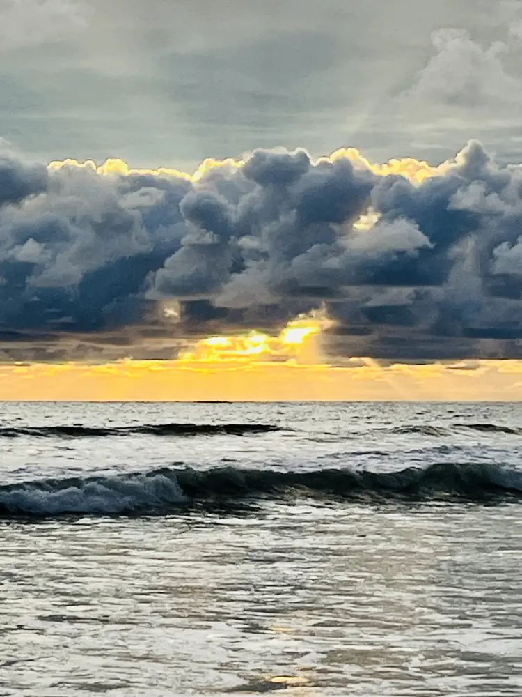 Storm clouds parting at sunset