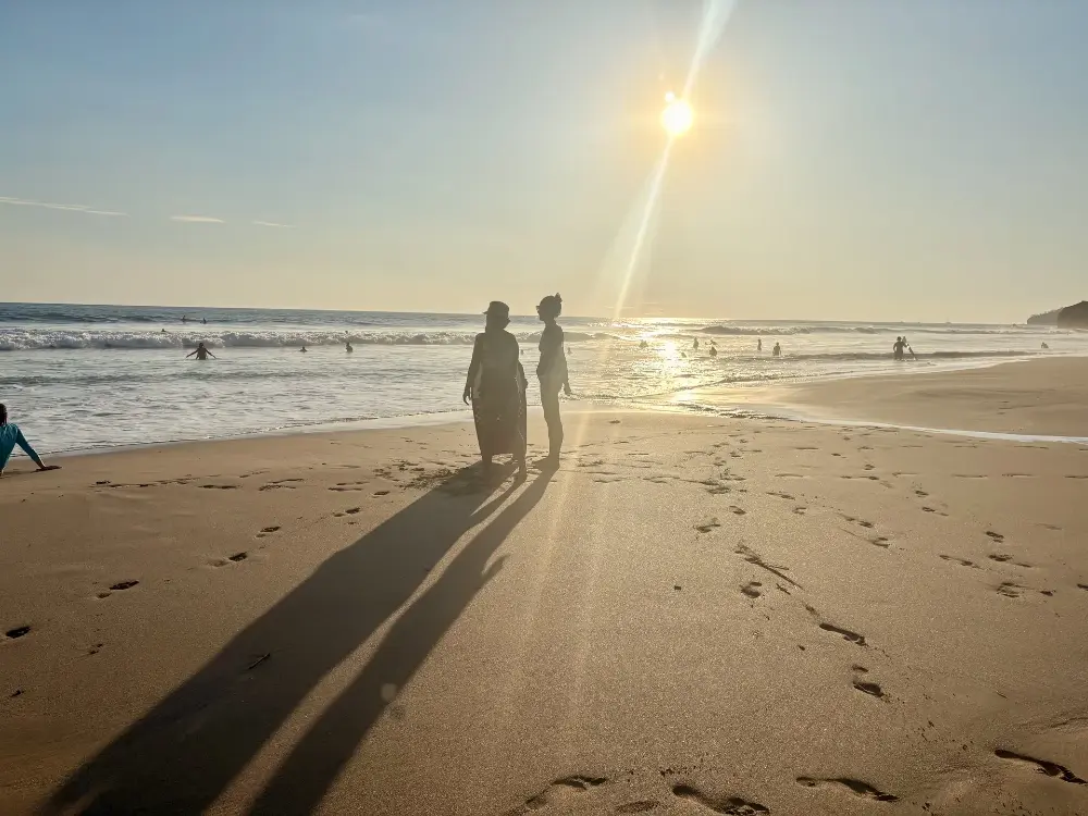 Long shadows and sunburst on the sand