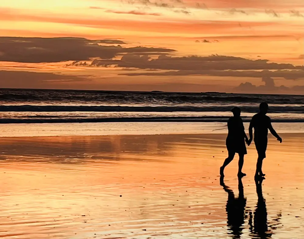 Walking hand in hand in the afterglow
