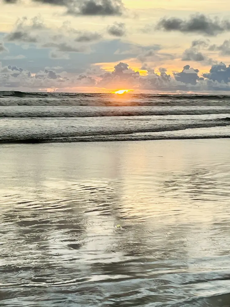 Sunset light on rippled wet sand